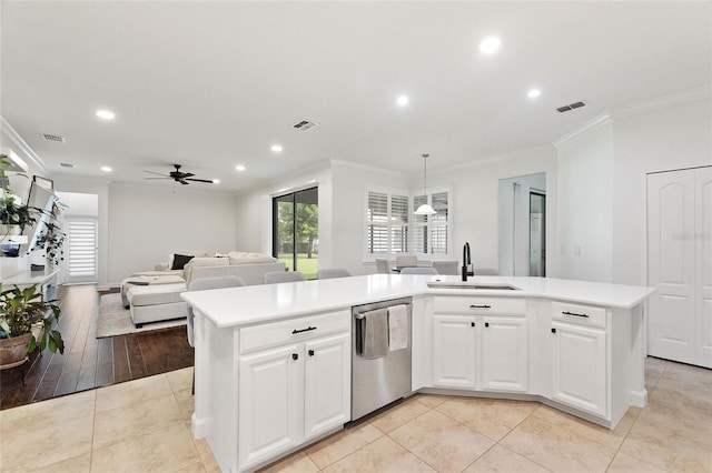 1406 Deuce Cir, Champions Gate, FL 33896 - kitchen with dishwasher, crown molding, a ceiling fan, light countertops, and recessed lighting