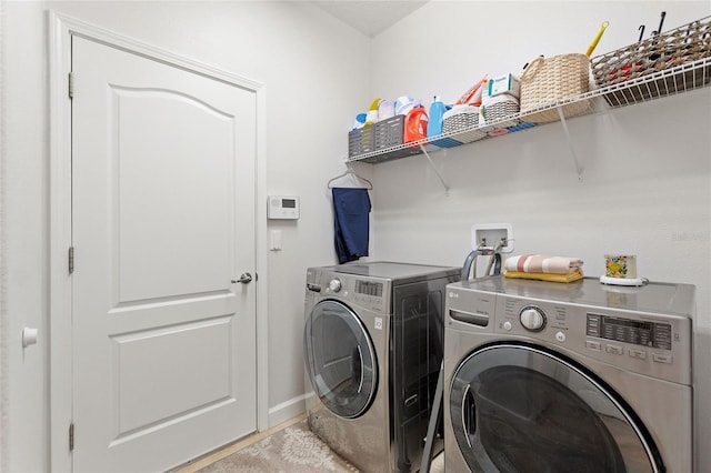 1406 Deuce Cir, Champions Gate, FL 33896 - laundry room with independent washer and dryer and baseboards