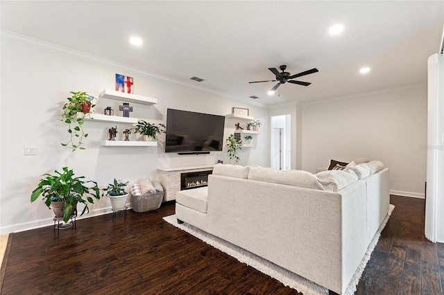 1406 Deuce Cir, Champions Gate, FL 33896 - living room with recessed lighting, a ceiling fan, a glass covered fireplace, dark wood finished floors, and ornamental molding