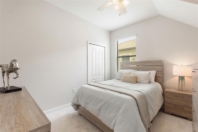 1406 Deuce Cir, Champions Gate, FL 33896 - bedroom with light colored carpet, lofted ceiling, a ceiling fan, and a closet