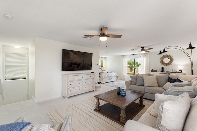 1406 Deuce Cir, Champions Gate, FL 33896 - living room featuring a ceiling fan and light colored carpet