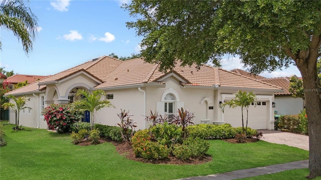 11222 Rapallo Ln, Windermere, FL 34786 - mediterranean / spanish house featuring an attached garage, stucco siding, and a front lawn