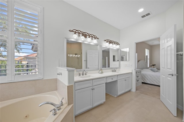 11222 Rapallo Ln, Windermere, FL 34786 - full bathroom with double vanity, a jetted tub, tile patterned flooring, ensuite bathroom, and a tile shower