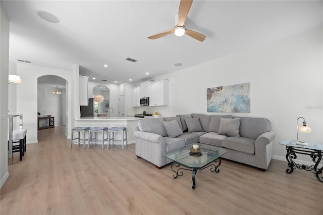 11222 Rapallo Ln, Windermere, FL 34786 - living area with a ceiling fan, light wood-style flooring, arched walkways, and recessed lighting