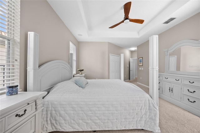 11222 Rapallo Ln, Windermere, FL 34786 - bedroom with a tray ceiling, light carpet, and ceiling fan