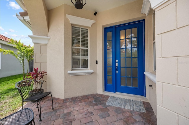 11222 Rapallo Ln, Windermere, FL 34786 - doorway to property with french doors and stucco siding