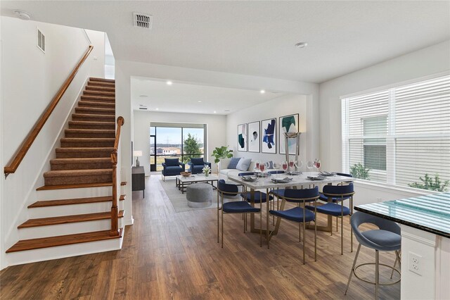 2604 Pinnacle, Clermont, FL 34711 - dining space featuring stairs, wood finished floors, and recessed lighting