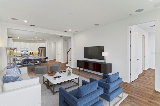 2604 Pinnacle, Clermont, FL 34711 - living area featuring wood finished floors, stairs, and recessed lighting