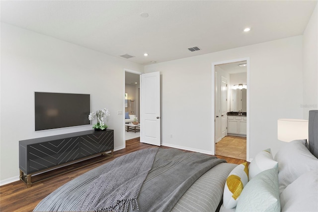 2604 Pinnacle, Clermont, FL 34711 - bedroom featuring wood finished floors, recessed lighting, and ensuite bathroom