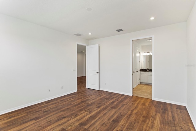 2604 Pinnacle, Clermont, FL 34711 - unfurnished bedroom featuring wood finished floors, recessed lighting, and connected bathroom