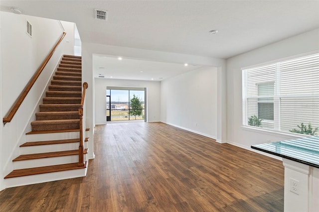 2604 Pinnacle, Clermont, FL 34711 - unfurnished living room featuring wood finished floors, stairs, and recessed lighting