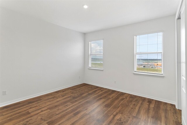 2604 Pinnacle, Clermont, FL 34711 - empty room with dark wood-style floors and recessed lighting