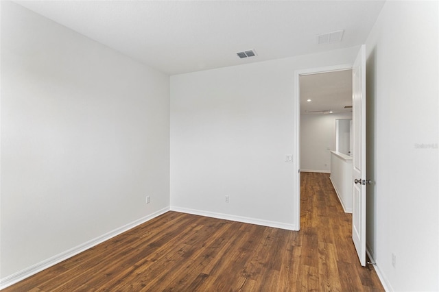 2604 Pinnacle, Clermont, FL 34711 - spare room featuring dark wood-style flooring and baseboards