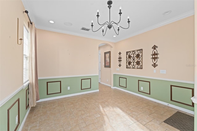 1011 Wood Cv, Kissimmee, FL 34743 - unfurnished room with stone tile floors, arched walkways, crown molding, a chandelier, and recessed lighting