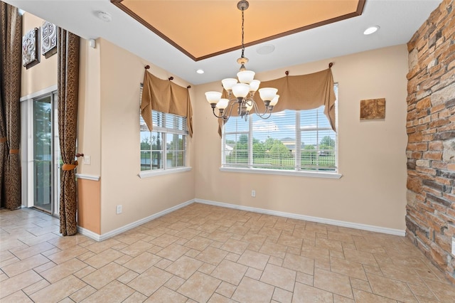 1011 Wood Cv, Kissimmee, FL 34743 - unfurnished dining area featuring stone finish floors, a chandelier, and recessed lighting