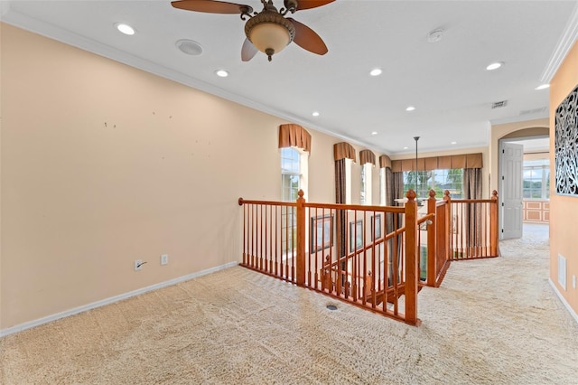 1011 Wood Cv, Kissimmee, FL 34743 - corridor with crown molding, light colored carpet, recessed lighting, and an upstairs landing
