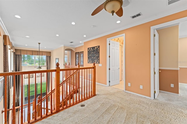 1011 Wood Cv, Kissimmee, FL 34743 - corridor with an upstairs landing, recessed lighting, light colored carpet, and ornamental molding