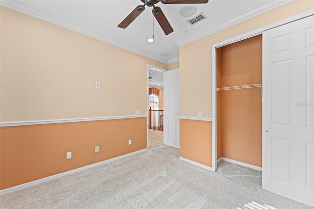 1011 Wood Cv, Kissimmee, FL 34743 - unfurnished bedroom featuring crown molding, carpet, a closet, and ceiling fan