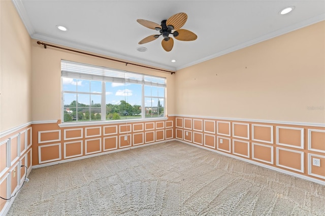 1011 Wood Cv, Kissimmee, FL 34743 - carpeted empty room with crown molding, a wainscoted wall, a decorative wall, and a ceiling fan