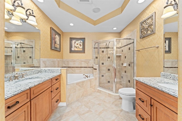 1011 Wood Cv, Kissimmee, FL 34743 - full bathroom with two vanities, a stall shower, a garden tub, recessed lighting, and tile walls