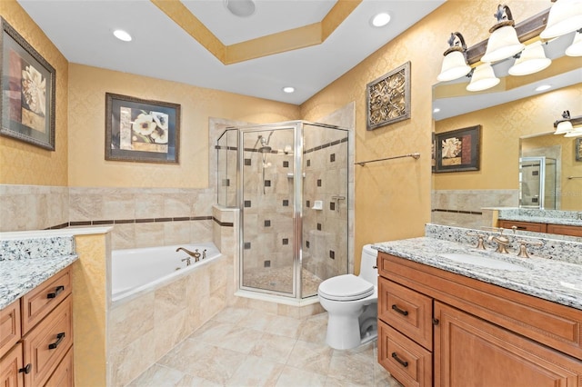 1011 Wood Cv, Kissimmee, FL 34743 - bathroom with vanity, a stall shower, a bath, tile walls, and recessed lighting