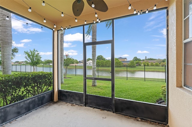 1011 Wood Cv, Kissimmee, FL 34743 - unfurnished sunroom with a water view
