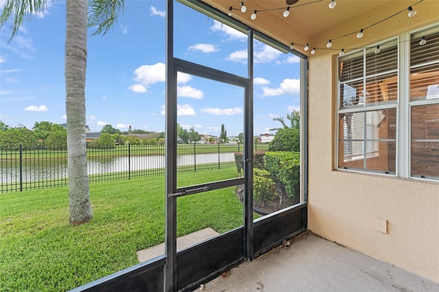 1011 Wood Cv, Kissimmee, FL 34743 - unfurnished sunroom featuring a water view