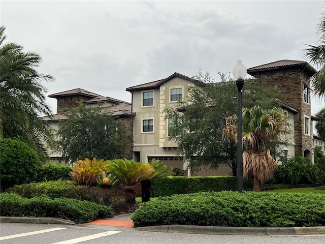 8512 Player Point Dr, Davenport, FL 33896 - view of building exterior featuring a garage