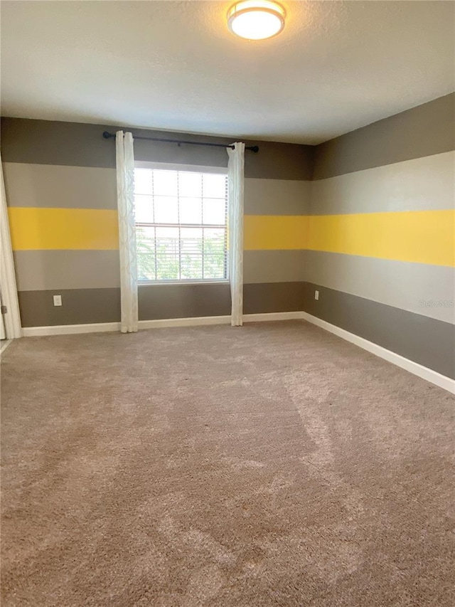 8512 Player Point Dr, Davenport, FL 33896 - carpeted empty room featuring baseboards