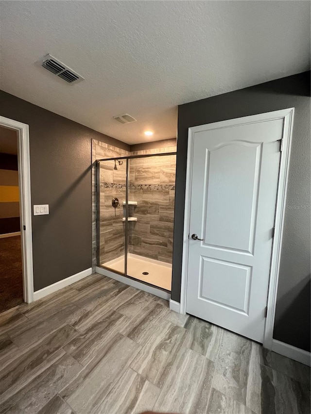 8512 Player Point Dr, Davenport, FL 33896 - empty room with a textured ceiling and wood finished floors