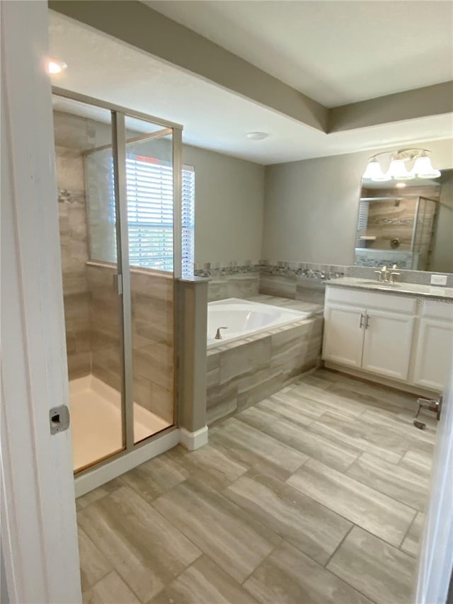 8512 Player Point Dr, Davenport, FL 33896 - bathroom with vanity, a bath, and a stall shower