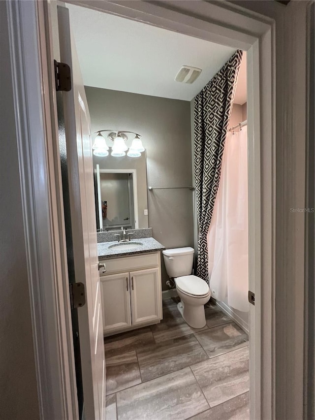 8512 Player Point Dr, Davenport, FL 33896 - bathroom with vanity and wood finished floors