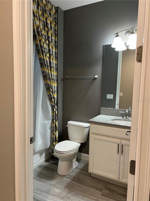 8512 Player Point Dr, Davenport, FL 33896 - bathroom with wood finished floors, vanity, and a shower with curtain