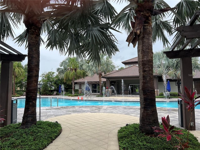 8512 Player Point Dr, Davenport, FL 33896 - community pool with a patio