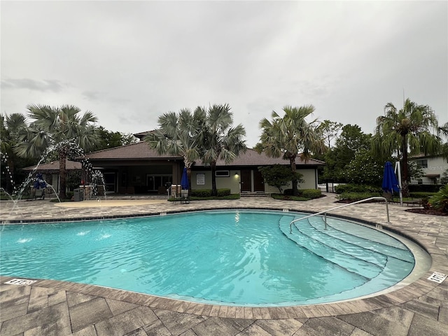 8512 Player Point Dr, Davenport, FL 33896 - community pool with a patio area