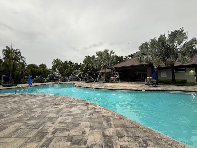 8512 Player Point Dr, Davenport, FL 33896 - community pool featuring a patio