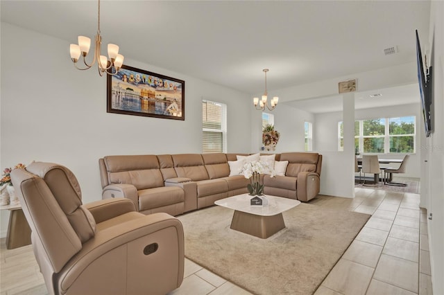 2912 Sanctuary Dr, Clermont, FL 34714 - living room featuring a chandelier and light tile patterned floors