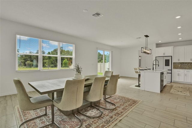 2912 Sanctuary Dr, Clermont, FL 34714 - dining space with recessed lighting and a chandelier