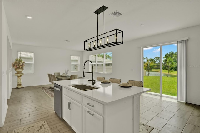 2912 Sanctuary Dr, Clermont, FL 34714 - kitchen featuring stainless steel dishwasher, decorative light fixtures, plenty of natural light, and recessed lighting