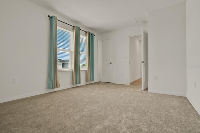 2912 Sanctuary Dr, Clermont, FL 34714 - spare room with light carpet and baseboards
