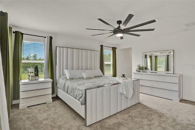 2912 Sanctuary Dr, Clermont, FL 34714 - carpeted bedroom featuring multiple windows and a ceiling fan
