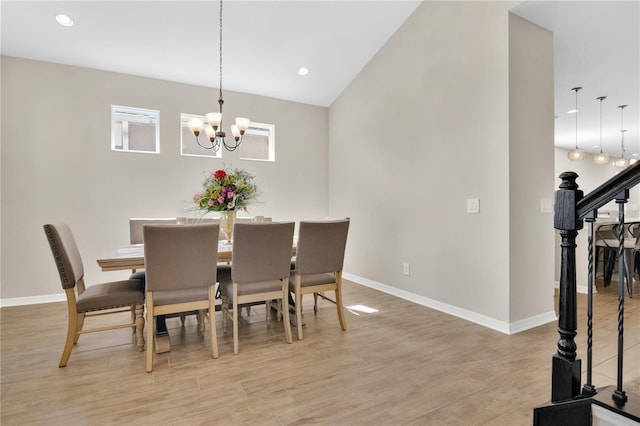 1564 Atlantic Coastline Loop, Oakland, FL 34787 - dining space with a chandelier, light wood finished floors, stairway, recessed lighting, and vaulted ceiling
