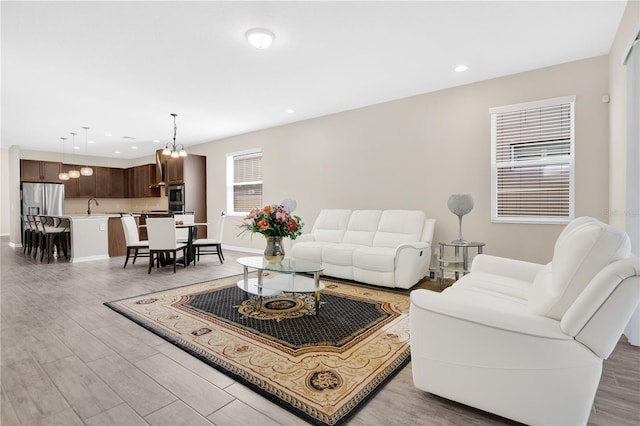 1564 Atlantic Coastline Loop, Oakland, FL 34787 - living room featuring light wood-type flooring and recessed lighting