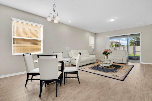 1564 Atlantic Coastline Loop, Oakland, FL 34787 - dining space featuring wood finished floors, a chandelier, and recessed lighting