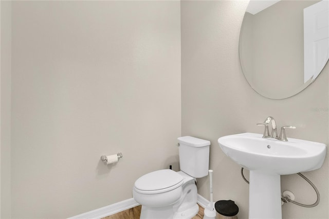 1564 Atlantic Coastline Loop, Oakland, FL 34787 - half bathroom featuring toilet and wood finished floors