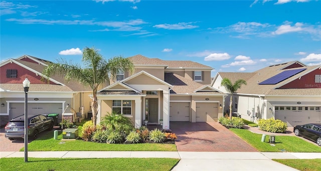1564 Atlantic Coastline Loop, Oakland, FL 34787 - view of front of home with decorative driveway, stucco siding, a garage, and a front lawn