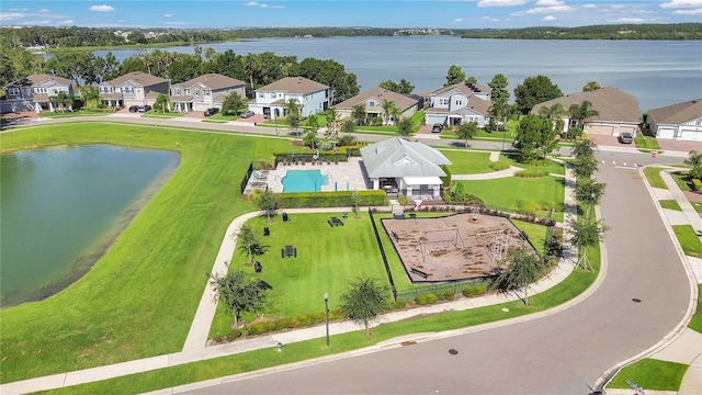 1564 Atlantic Coastline Loop, Oakland, FL 34787 - aerial view of residential area with a pool and a large body of water