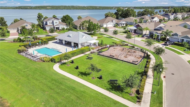 1564 Atlantic Coastline Loop, Oakland, FL 34787 - aerial perspective of suburban area featuring a pool area and a nearby body of water