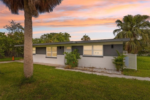 4505 Cottonwood Dr, New Port Richey, FL 34652 - single story home with a lawn and stucco siding