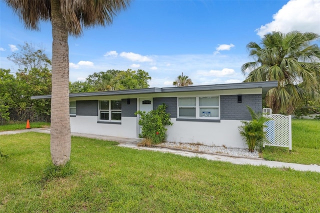 4505 Cottonwood Dr, New Port Richey, FL 34652 - ranch-style home with a front lawn